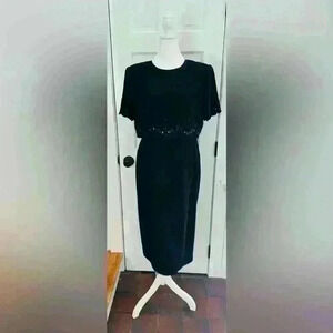 R & M Richard’s black cocktail dress, short sleeves with scallop edge. Size 12.